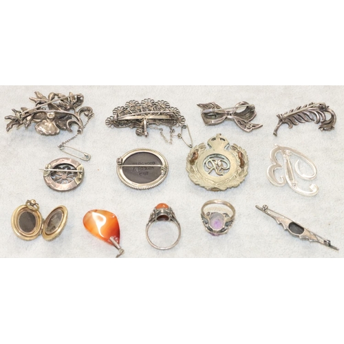 254 - A silver and cut steel floral brooch and a small quantity of various similar jewellery and a Royal E... 