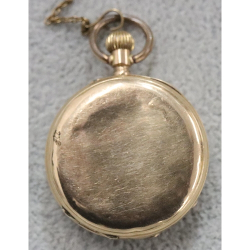 256 - A 14ct gold small fob watch with chased floral decoration and Roman numerals (starts but then stops)... 