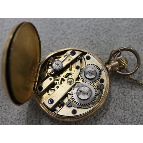 256 - A 14ct gold small fob watch with chased floral decoration and Roman numerals (starts but then stops)... 