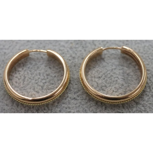 261 - A pair of gold circular earrings, 2.2 grams