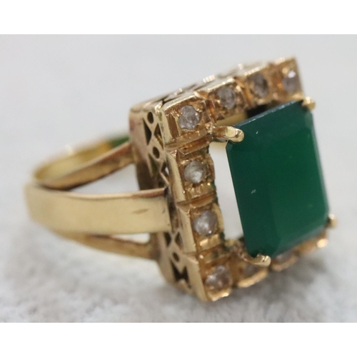 263 - A Continental gold rectangular shaped ring set with centre green stone surrounded by clear stones, S... 