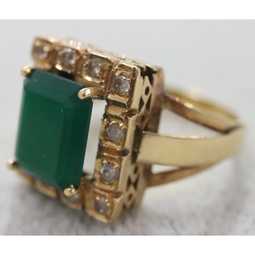 263 - A Continental gold rectangular shaped ring set with centre green stone surrounded by clear stones, S... 