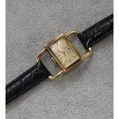 267 - An 18ct gold ladies' Jaeger Le Coultre wristwatch with rectangular shaped dial and open shoulders, l... 