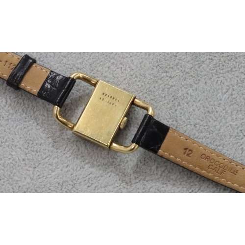 267 - An 18ct gold ladies' Jaeger Le Coultre wristwatch with rectangular shaped dial and open shoulders, l... 