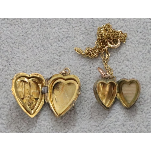 270 - A small oval gold heart shaped locket mounted with anchor inset with half pearls and another gold ha... 