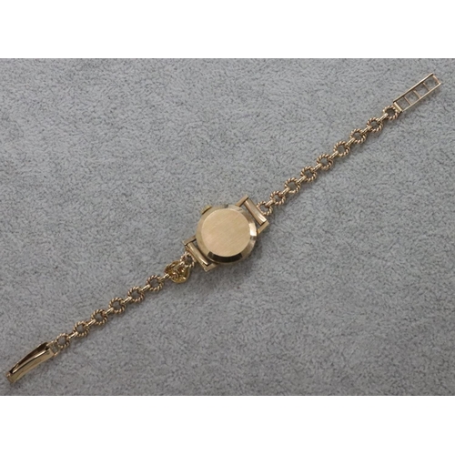 274 - A 9ct gold Garrard ladies' circular wristwatch with matching 9ct gold strap bracelet, 11.3 grams gro... 