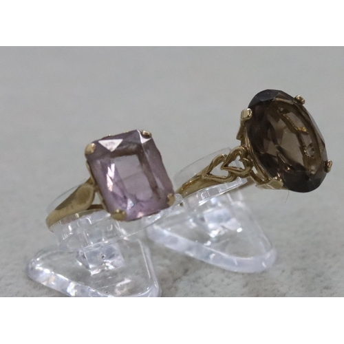 282 - A 9ct gold smoky quartz ladies' ring, Size T/U and another ladies' ring set with pale purple stone, ... 