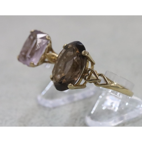 282 - A 9ct gold smoky quartz ladies' ring, Size T/U and another ladies' ring set with pale purple stone, ... 