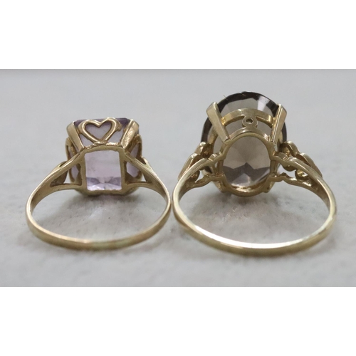 282 - A 9ct gold smoky quartz ladies' ring, Size T/U and another ladies' ring set with pale purple stone, ... 