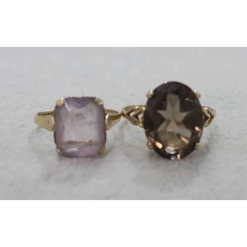 282 - A 9ct gold smoky quartz ladies' ring, Size T/U and another ladies' ring set with pale purple stone, ... 