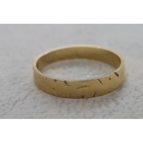 283 - An 18ct gold wedding ring, Size Q/R, 2.6 grams