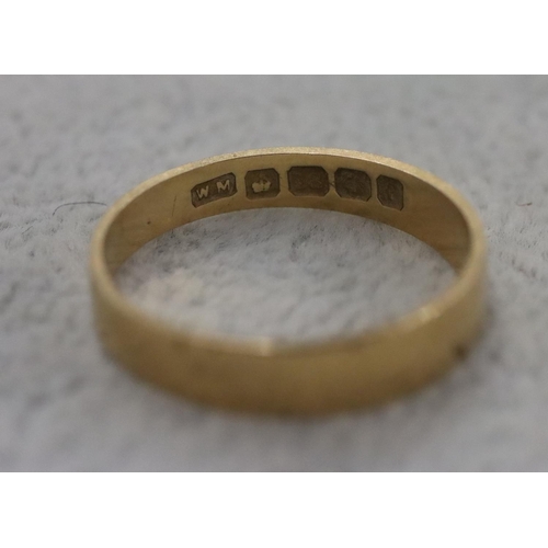 283 - An 18ct gold wedding ring, Size Q/R, 2.6 grams