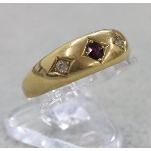 284 - An 18ct gold Gypsy ring set with centre ruby flanked by 2 small diamonds, Size O, 3.6 grams gross