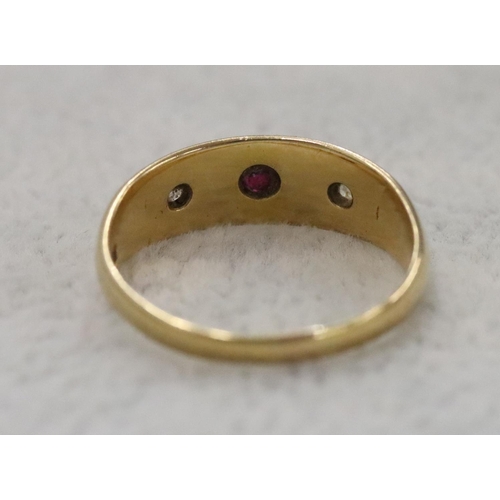 284 - An 18ct gold Gypsy ring set with centre ruby flanked by 2 small diamonds, Size O, 3.6 grams gross