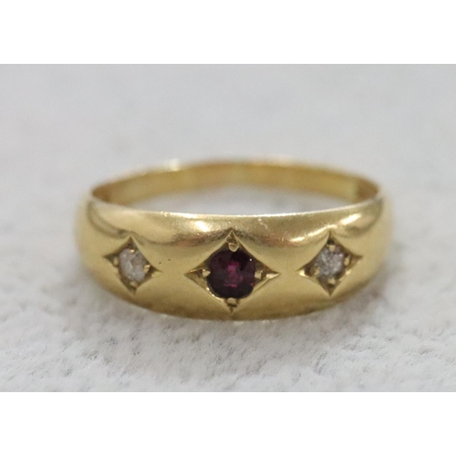 284 - An 18ct gold Gypsy ring set with centre ruby flanked by 2 small diamonds, Size O, 3.6 grams gross