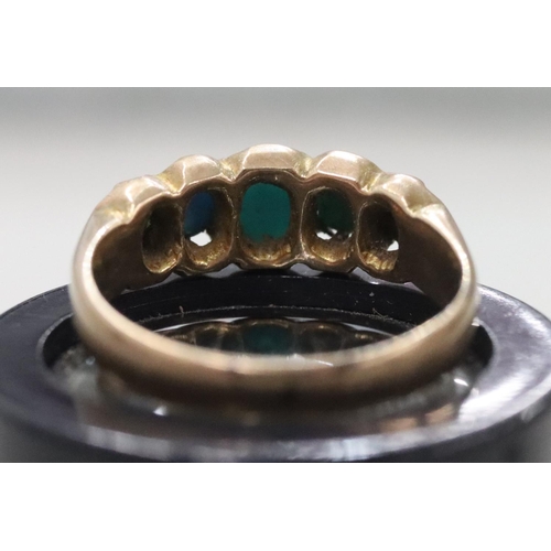 298 - A ladies' gold ring set with 5 turquoise, Size K/L, 2.8 grams gross