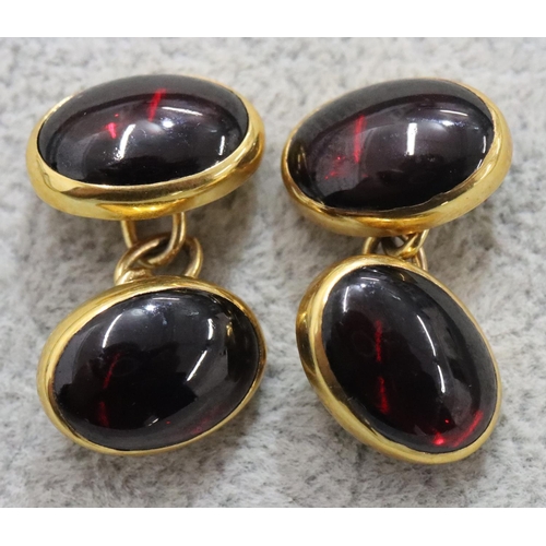 302 - A pair of 9ct gold oval red Cavachon cufflinks, 9.7 grams gross