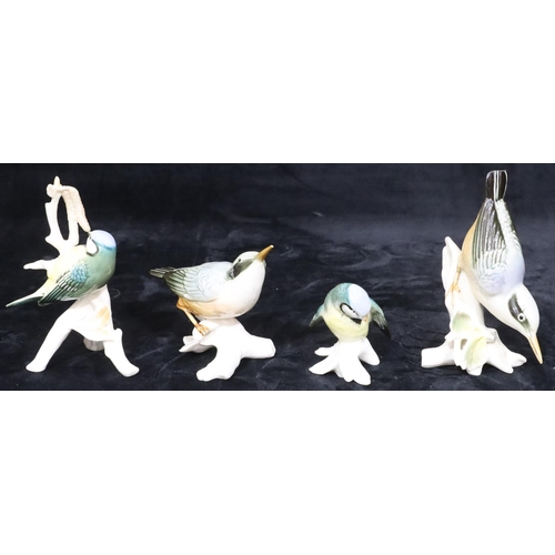 31 - 4 various Continental china figures of perched birds, largest 15.5cm high (4)