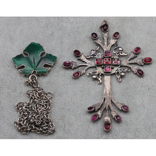 315 - A silver cross pendant mounted with red stones, 8.5cm high, a silver leaf shaped brooch set with mal... 