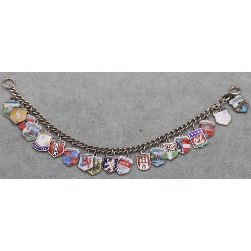 317 - A silver bracelet mounted with 19 silver and enamelled shield shaped charms, 29.5 grams gross