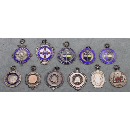 318 - 10 silver and enamelled badges, Surrey County Football Association etc., 83 grams gross, and another... 