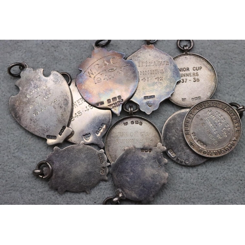 318 - 10 silver and enamelled badges, Surrey County Football Association etc., 83 grams gross, and another... 