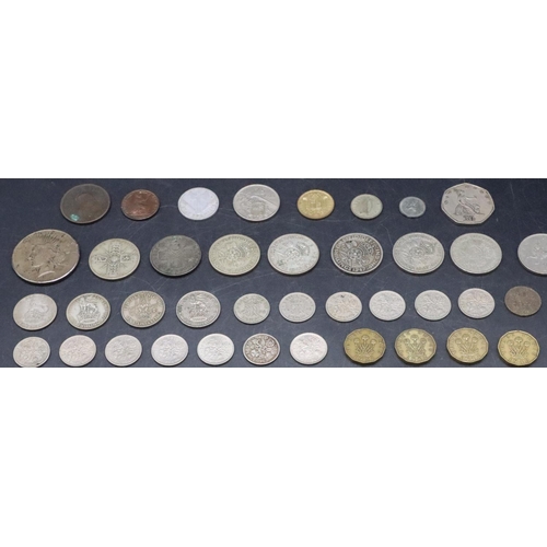 329 - A 1922 Dollar and 1931 Florin, a 1921 Florin, 4 other silver coins, a George III Penny 1807 and a sm... 