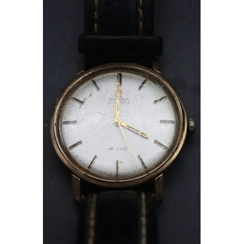 337 - A gold gentlemen's Omega circular wristwatch with seconds hand and leather strap (working) (box in n... 