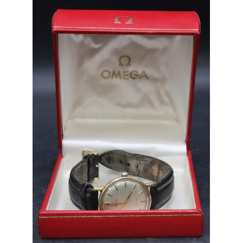 337 - A gold gentlemen's Omega circular wristwatch with seconds hand and leather strap (working) (box in n... 