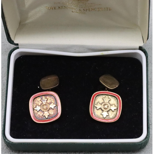 343 - A pair of silver and enamelled OBE cufflinks 