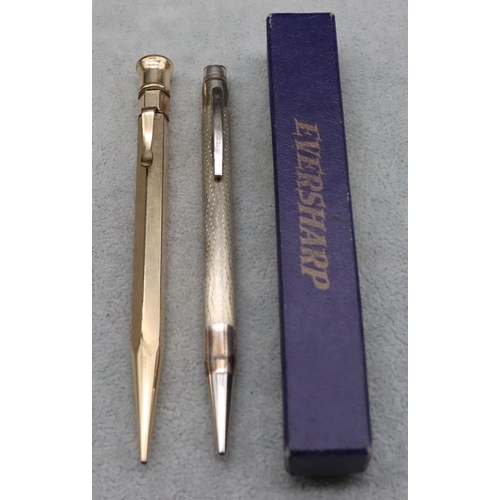 345 - A silver Eversharp propelling pencil with engine turned decoration, a Morden Eversharp gold plated p... 