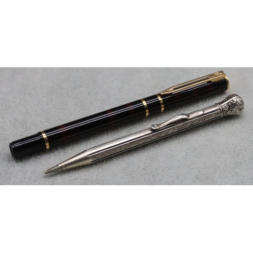 346 - A Continental 835 silver coloured metal propelling pencil with bright cut decoration and a Waterman ... 