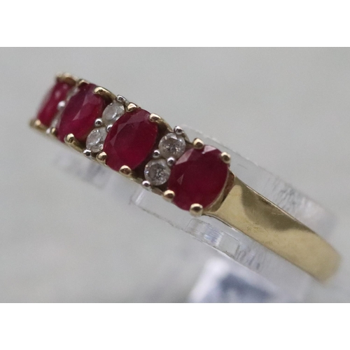 365 - A 9ct gold ladies' ring set with 4 rubies interspersed by 6 small diamonds, Size N/O, 2.6 grams