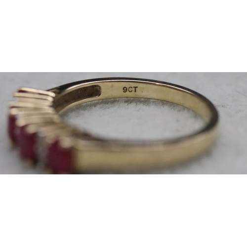 365 - A 9ct gold ladies' ring set with 4 rubies interspersed by 6 small diamonds, Size N/O, 2.6 grams