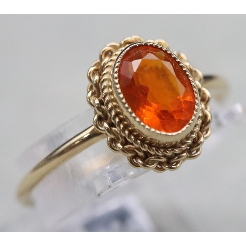 369 - A 9ct gold ladies' ring set with orange stone, Size L, 1.5 grams