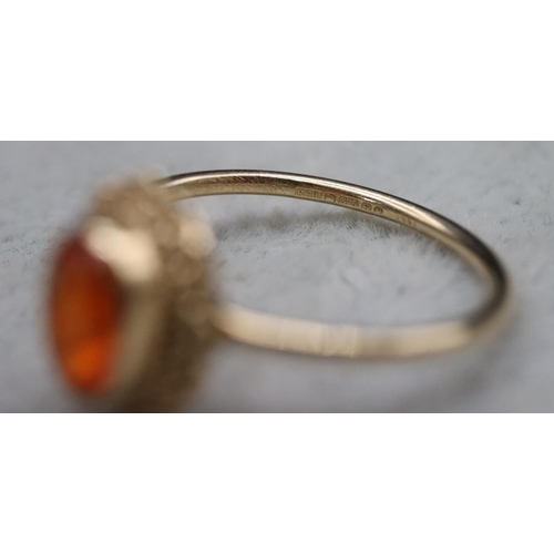 369 - A 9ct gold ladies' ring set with orange stone, Size L, 1.5 grams