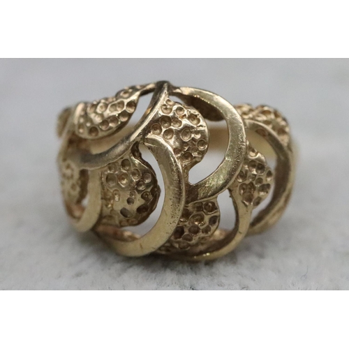 370 - A 9ct gold ring with pierced decoration, Size N, 3.3 grams