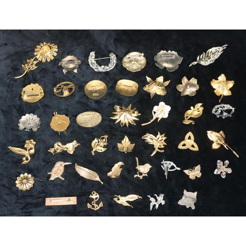 377 - A quantity of various costume and other brooches etc.