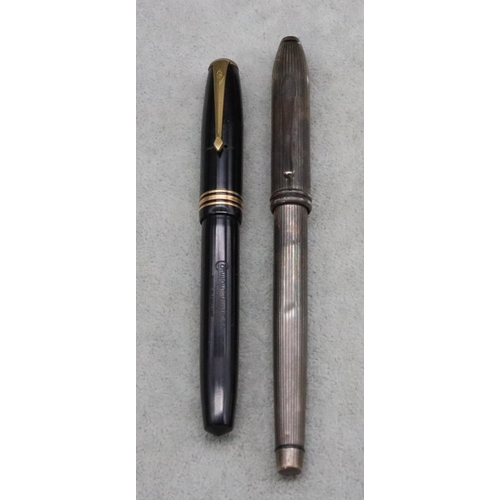 381 - A Conway Stewart 58 black fountain pen (boxed) and a silver Cross ballpoint pen (2)