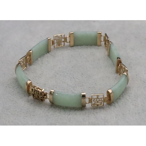 386 - A 9ct gold and jade panel bracelet, 18cm long