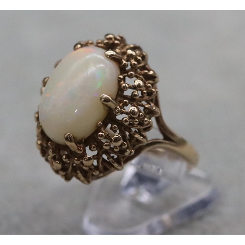 392 - A 9ct gold ladies' oval cluster ring set with centre opal, Size O/P, 6.2 grams gross