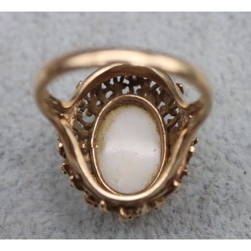 392 - A 9ct gold ladies' oval cluster ring set with centre opal, Size O/P, 6.2 grams gross