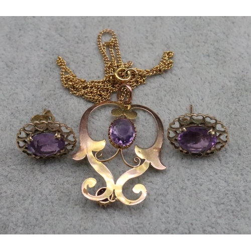 394 - A 9ct gold drop pierced pendant set with 2 amethysts, with 9ct gold linked chain, 3.4 grams gross an... 