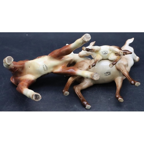 40 - A Beswick figure of a Doe with her young, 15cm high and a Beswick figure of a calf, 12cm high (3)