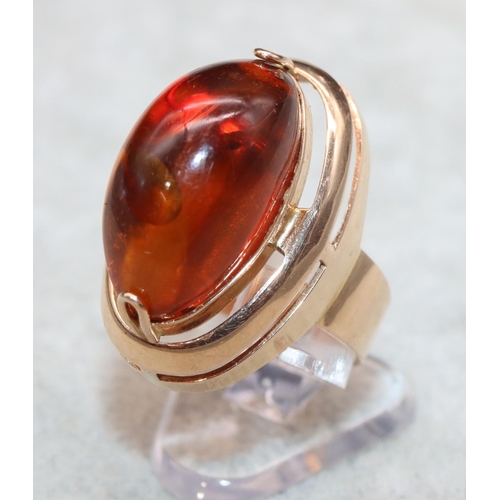 405 - A Continental gold ring with oval amber, Size M/N, 7.2 grams gross