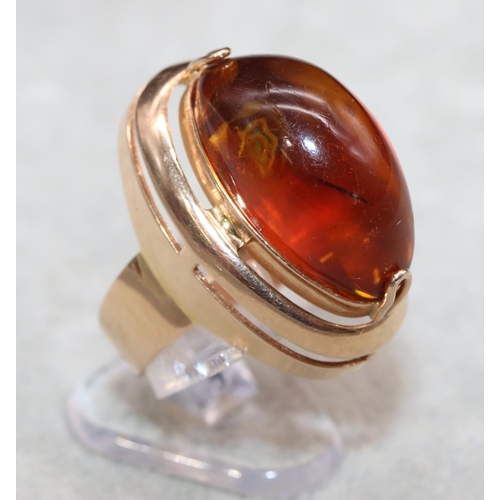 405 - A Continental gold ring with oval amber, Size M/N, 7.2 grams gross