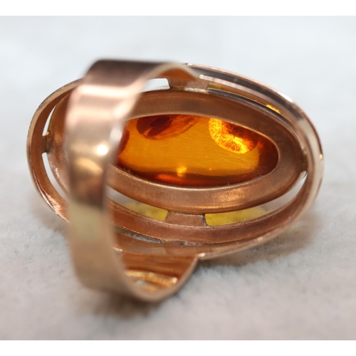 405 - A Continental gold ring with oval amber, Size M/N, 7.2 grams gross