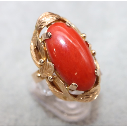 406 - A continental gold ladies' ring set with red coral with pierced decoration, Size M/N, 7.5 grams gros... 