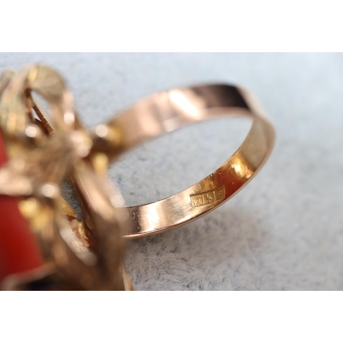 406 - A continental gold ladies' ring set with red coral with pierced decoration, Size M/N, 7.5 grams gros... 