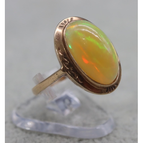 407 - A 9ct gold ladies' oval opal ring, Size L, 2.9 grams gross